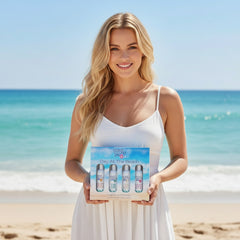 Ocean Laguna Day At The Beach fragrance collection packaging with four bottles on a beach background