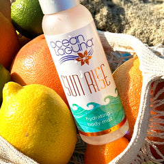 Ocean Laguna Sunrise Body Mist Ocean Citrus and salt air on beach in beach bag